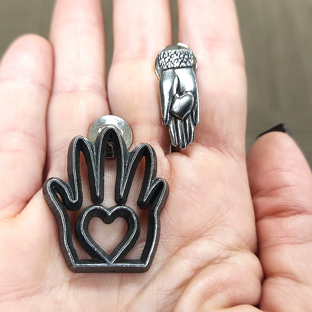 Pair Of Pewter Heart In Hand Clutch Pins